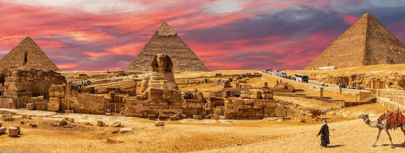 Ancient Egyptian pyramids at Giza with the Great Sphinx in the foreground